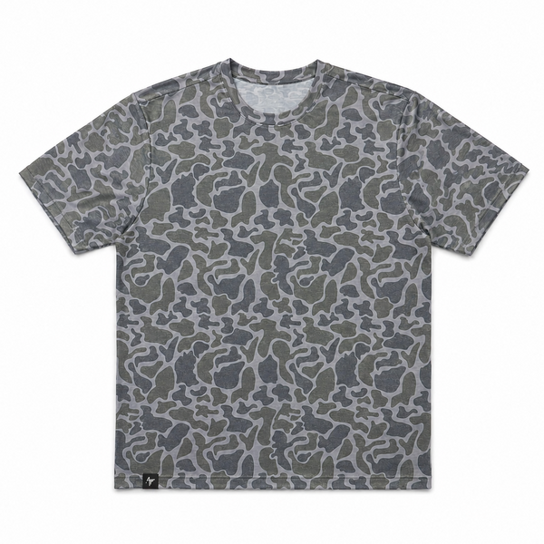 A short-sleeve crewneck t-shirt featuring an all-over abstract camouflage pattern in shades of gray, olive green, and dark charcoal, displayed flat against a solid white background.