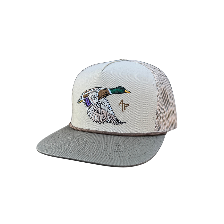 A white and gray trucker hat featuring an embroidered flying mallard duck on the front panel and a small '47' monogram logo on the side, set against a plain white background.