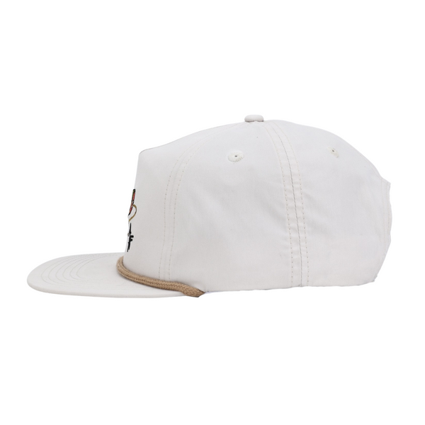 Cream cap with a brown brim on a white background