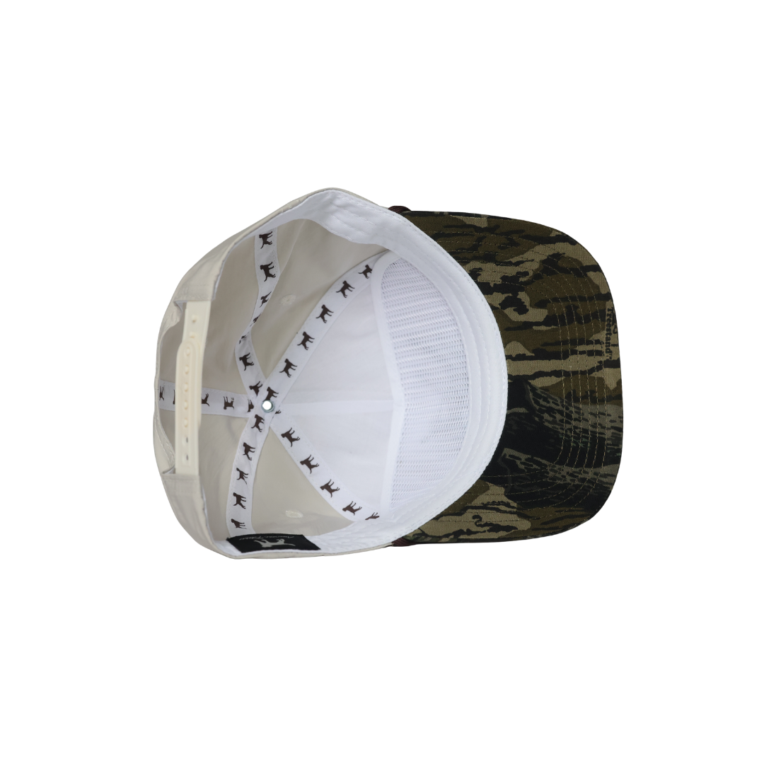 Inside of cream hat showing details and visor built in to help keep hat structured on the front.