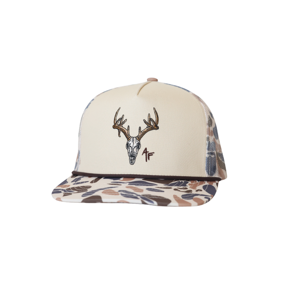 Cap with deer skull design and camouflage pattern on a white background