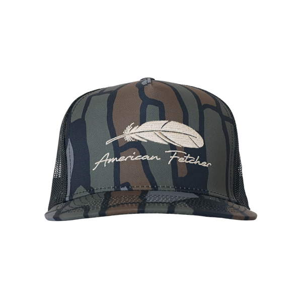 A camouflage trucker hat with a white embroidered feather and 'American Fetcher' script on the front, shown against a plain white background.