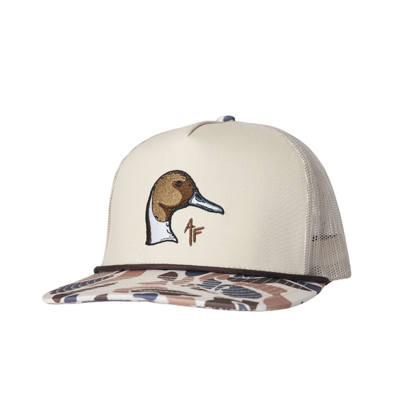 A trucker-style cap with an off-white front panel, a pintail duck head embroidery on the front, and a brown camouflage-patterned visor, shown against a plain white background.