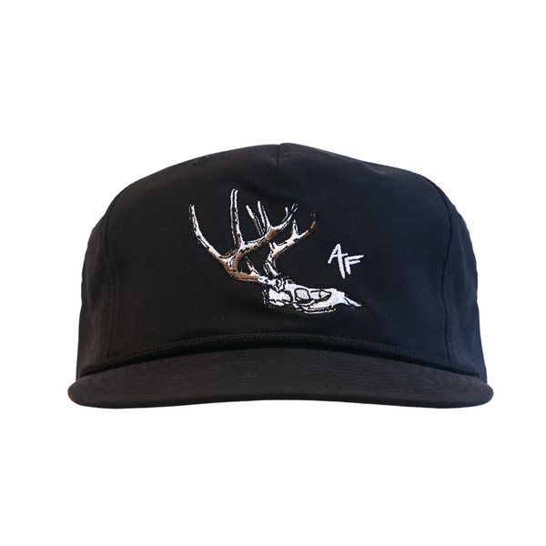 A soft, black five-panel baseball cap featuring an embroidered white deer skull with antlers and a small white AF logo on the front, set against a plain white background.