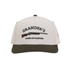 Cream hat that says "grandpa's raised on tradition with a smoke pole design" hand me down.