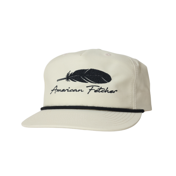 Birch color hat. Feather design on the front. No mesh, solid fabric with black rope.