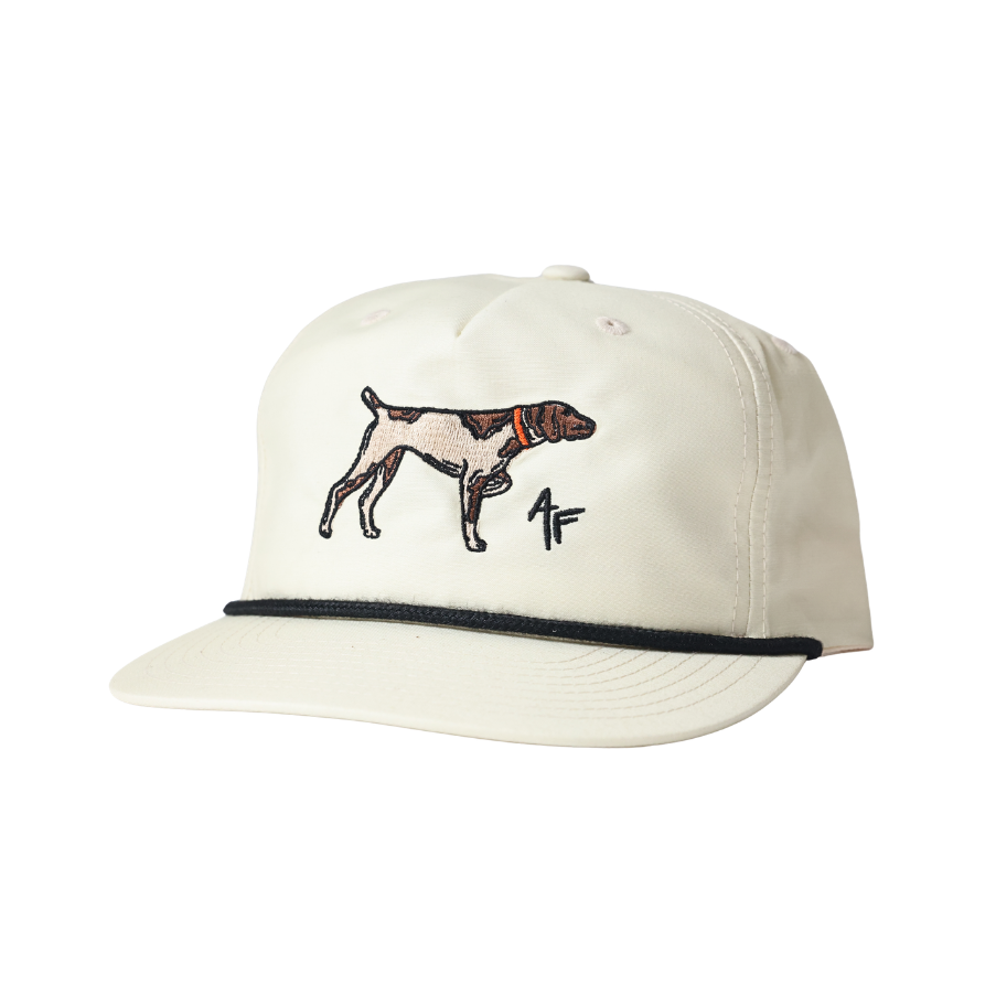 An off-white baseball cap featuring an embroidered dog and a stylized 'AF' logo on the front, with a black piping accent along the edge of the flat brim.