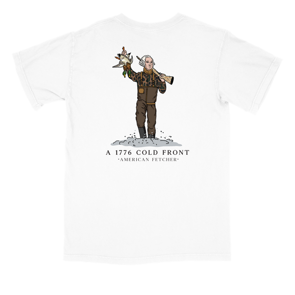 A white short-sleeve crewneck t-shirt featuring a graphic print of a cartoon character dressed in winter gear holding a rifle and a bird, with the text 'A 1776 COLD FRONT' and 'AMERICAN FETCHER' printed below.