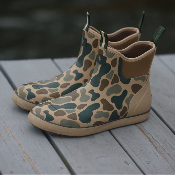 Pair of waterproof deck boots on a deck 